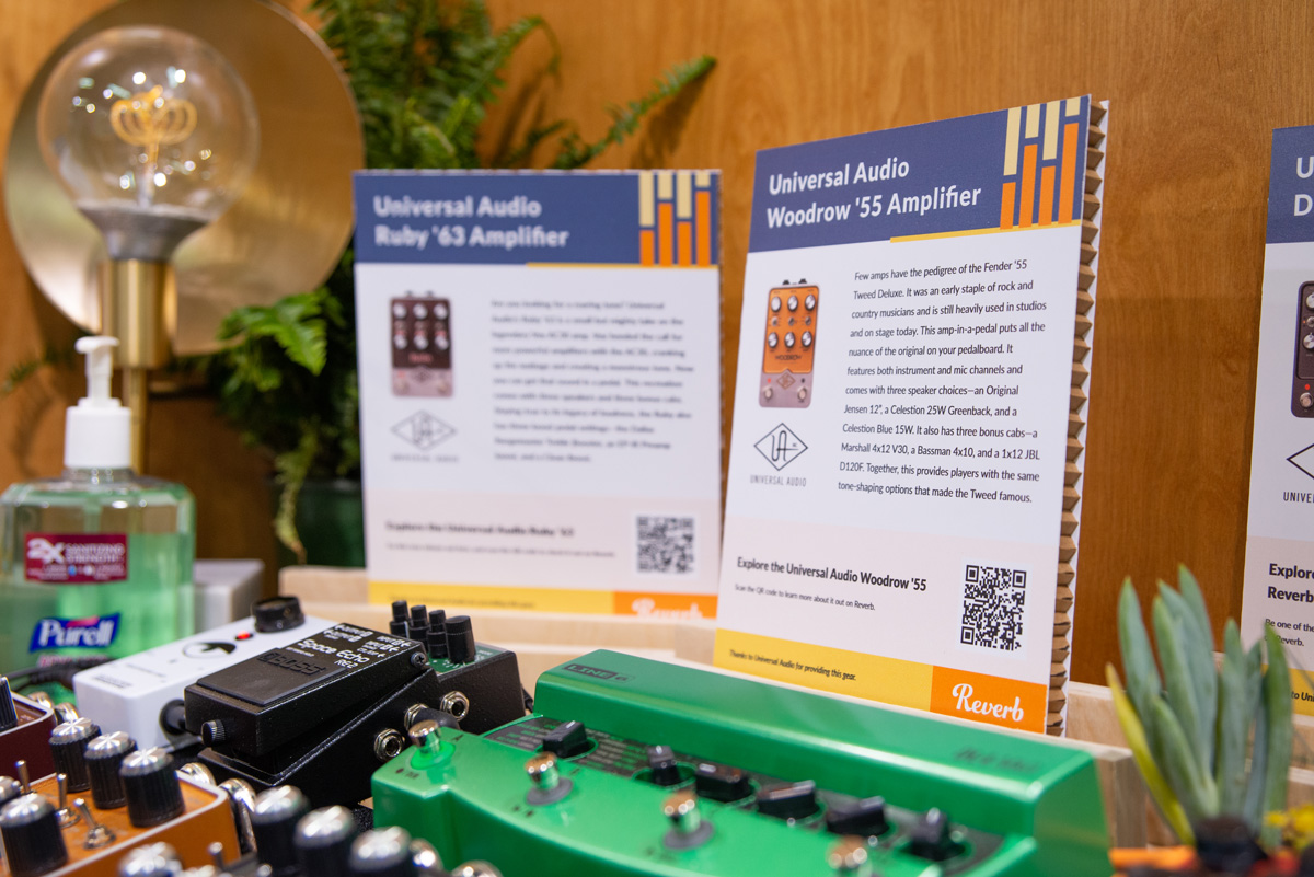 Photo of pedal signs behind a pedalboard